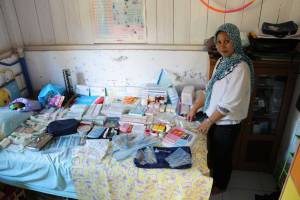 Medang Island midwife Mitha recieves her yearly resupply of medi